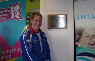 Jo Jackson beside plaque