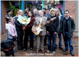 ratcliffe-present-guitar-to-85yr-winner