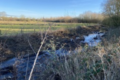 Barkby-Brook-overgrown-with-vegetation-Meadow-Lane